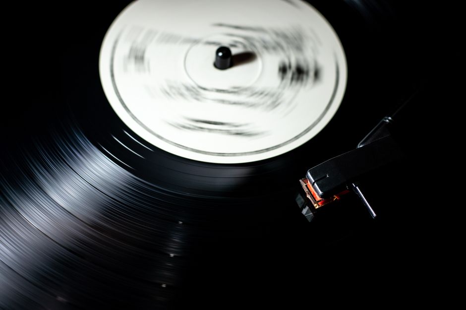 Classic vintage vinyl record spinning smoothly on a turntable platter (Image Credit: Miguel Á. Padriñán - Pexels)