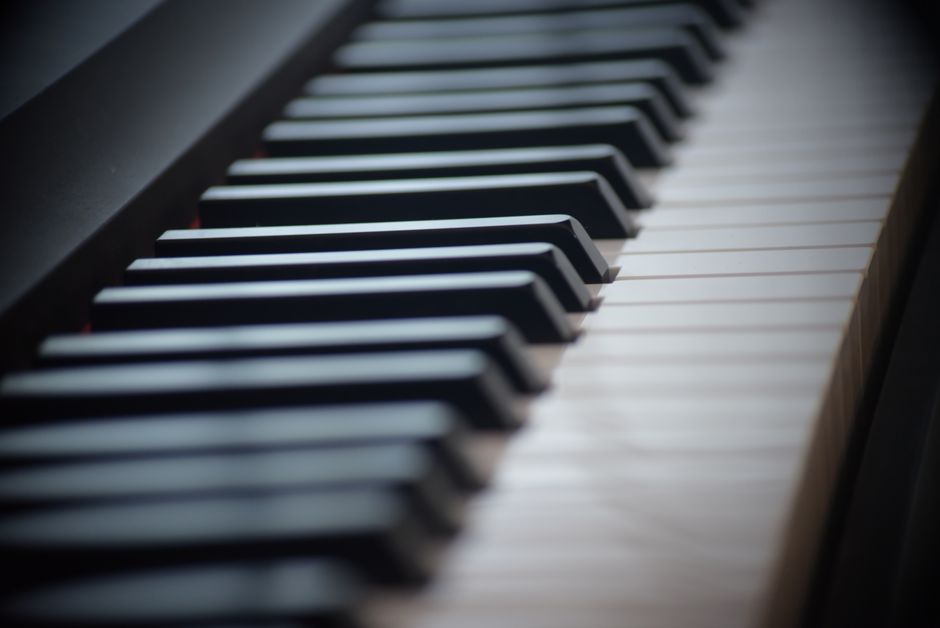 Close-up of black and white piano keys highlighting harmonic chord structures (Image Credit: James Whincup - Pexels)